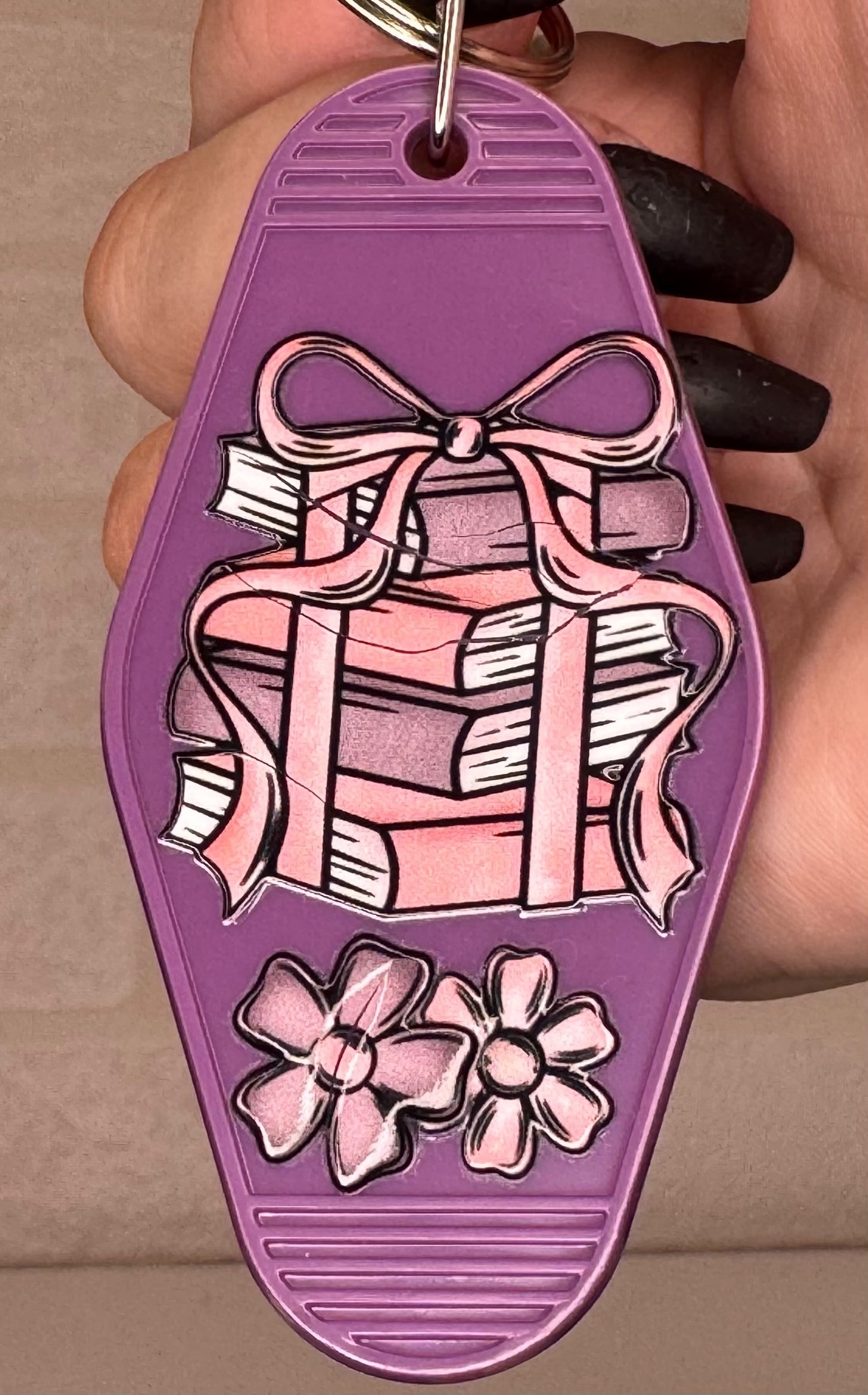 book themed motel keyring